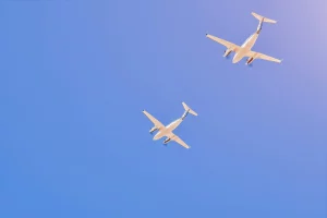two airplanes flying in blue sky
